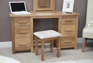Bury Solid Oak large dressing table. with matching stool inclused with cream upholstered pad and six drawers