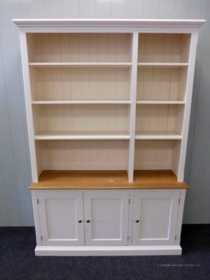 Edmunds Painted 3 door library bookcase. Adjustable shelves, 3 cupboards underneath with oak top on cupboards. Elegant cornice and plinths. Image showing doors open. EDM049