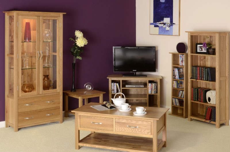 Image of room set Norwich oak occasional furniture, corner tv unit, 2 drawer coffee table, cd/dvd rack, bookcase and glazed unit by edmunds & clarke furniture