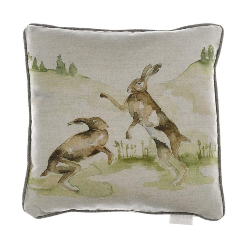 Voyage Maison Boxing Hares Cushion. two hares boxing on linen background. square with contrasting piping