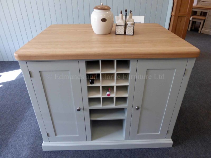 Edmunds painted 4ft x 3ft kitchen Island in Southwold Sky Blue. Solid oak top. Central shelves and wine rack with 2 paneled doors and on other side a overhang for stools. EDM008