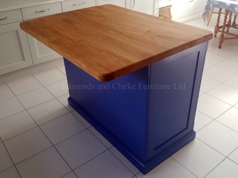 Edmunds painted 4ft x 3ft kitchen Island Colour Match. Solid oak top. Central shelves with 2 paneled doors and on other side a overhang for stools. EDM008
