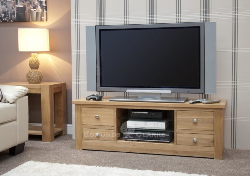 solid oak chunky square edge tv stand with two drawers down either side and open space and three shelves in centre 140cm wide