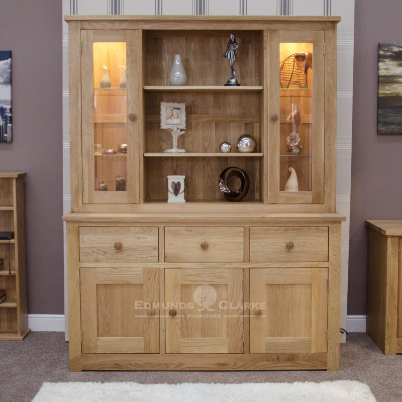 solid oak dresser three doors and drawers in sideboard, 2 full length glazed doors above with open section in centre with two shelves