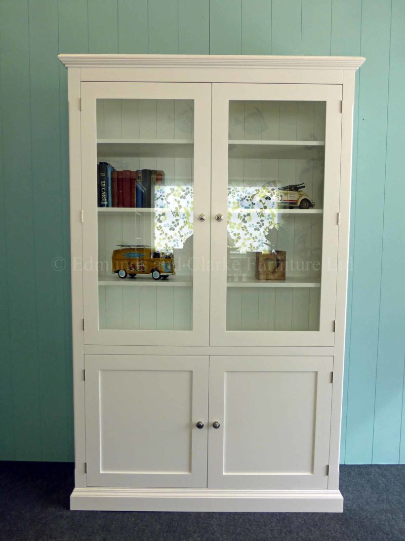 Painted white glazed paneled bookcase, two glazed doors above with two paneled doors below all shelves adjustable