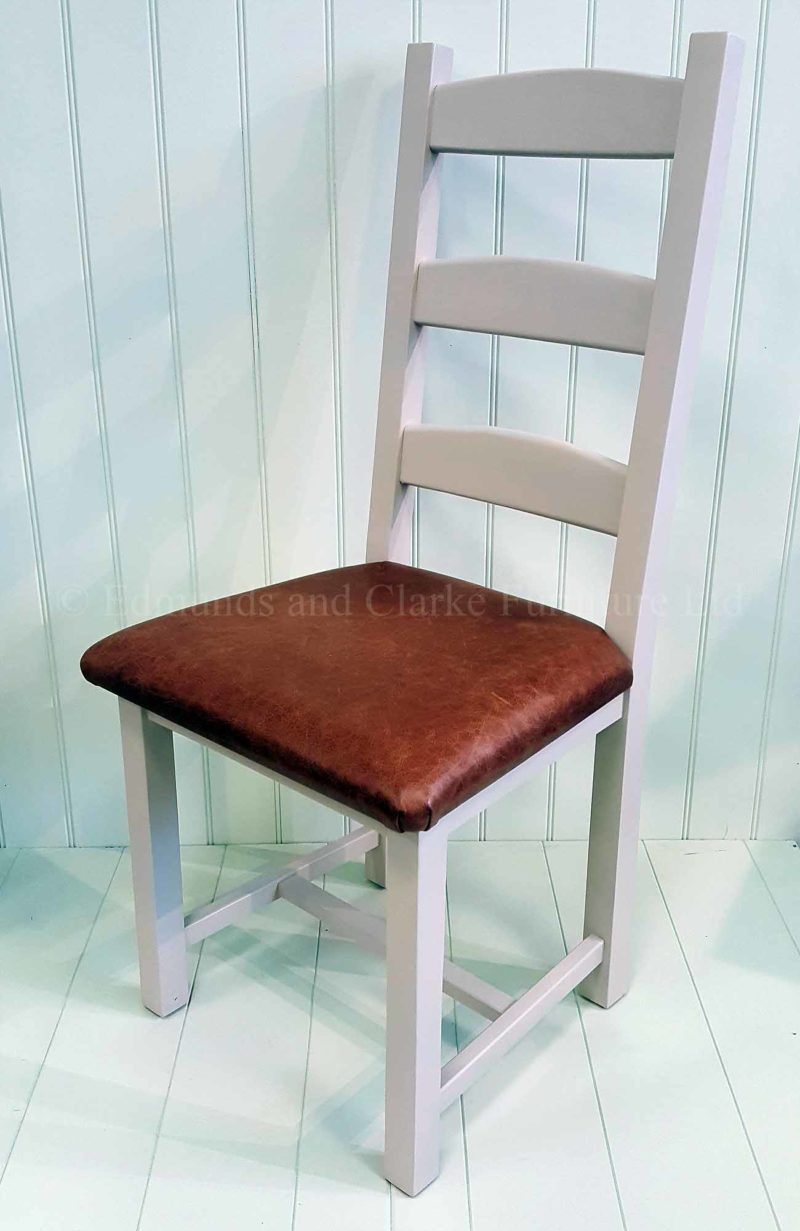 Edmunds Amish dining chair, image showing dunwich stone with genuine leather seat pad dark brown. Chair frame available painted, waxy lacquer feel or solid oak, choose your options