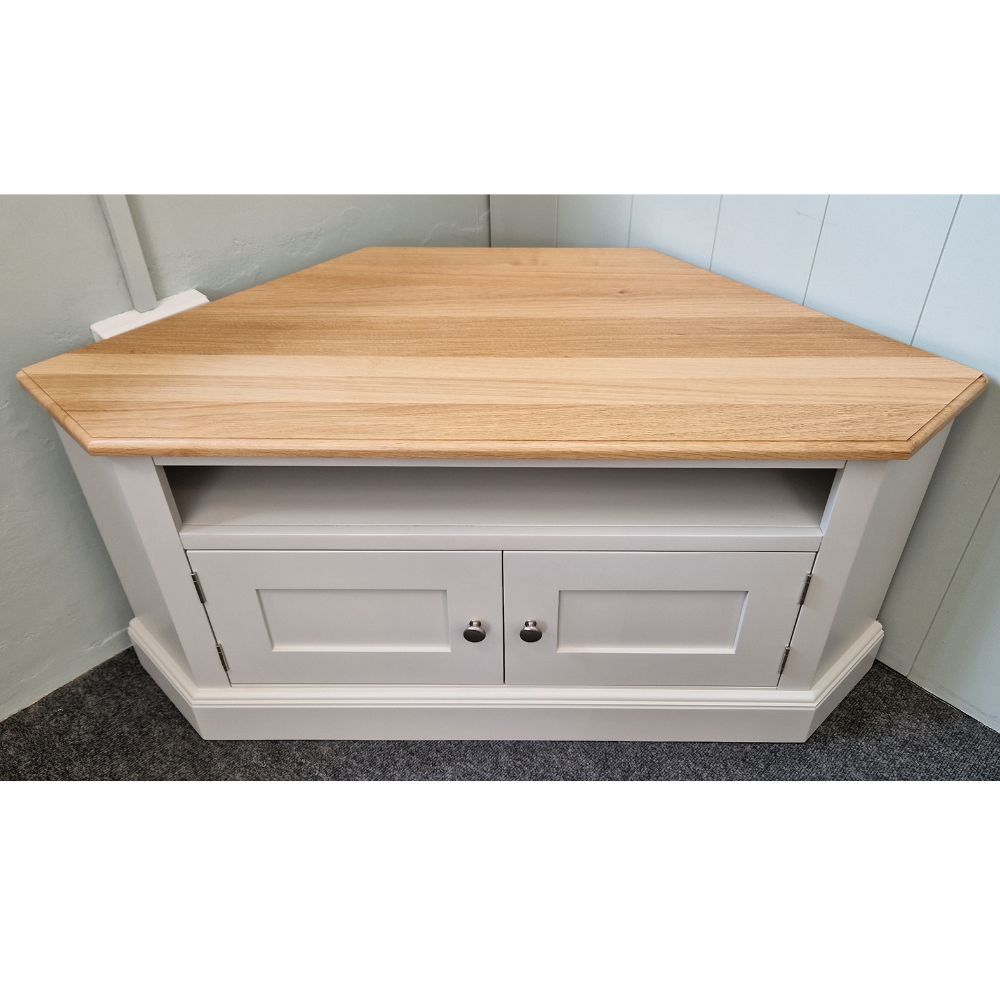 Edmunds painted corner tv unit with oak top and doors and gap. Edmunds & Clarke Furniture