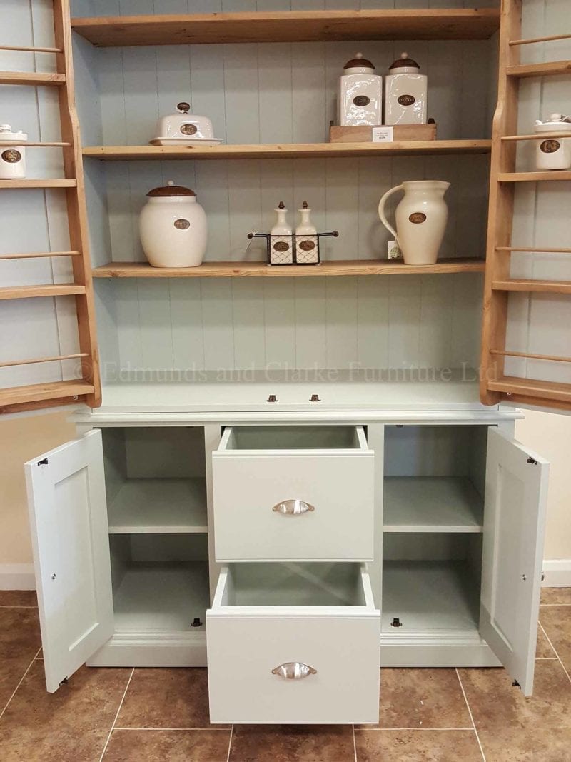 Kitchen larder pantry cupboard made with two large doors above, two central pan drawer and small cupboard below either side of the pan drawers