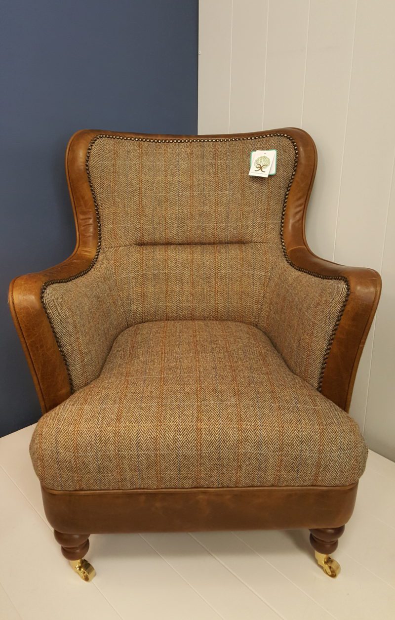 Vintage Sofa Co Ellis FT Chair low slung armchair in hunting lodge harris tweed and cerato leather edging on brass castors