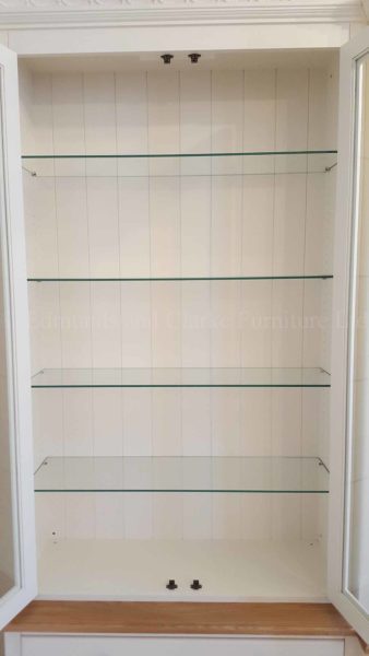 bespoke painted breakfront television storage unit close up of glass shelves