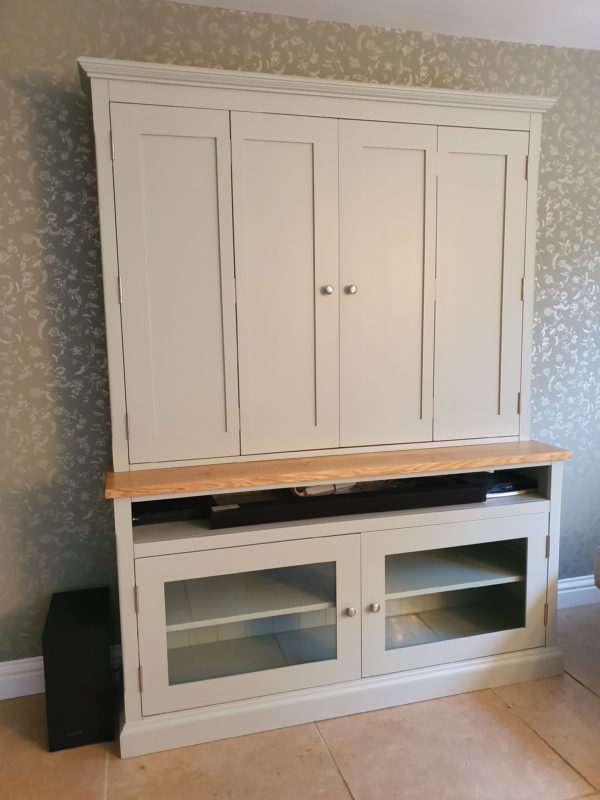 Bespoke Television Cupboard painted with oak top tv hidden behind bifold doors