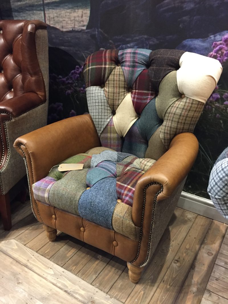 Vintage Sofa Co Gotham Harlequin Fast Track Chair in patchwork harris tweed and wool fabric with cerato brown leather arms and detailing on turned oak legs in showroom
