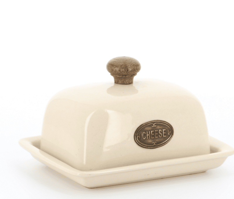 Ceramic covered cheese dish with wooden knob and metal cheese plaque side view