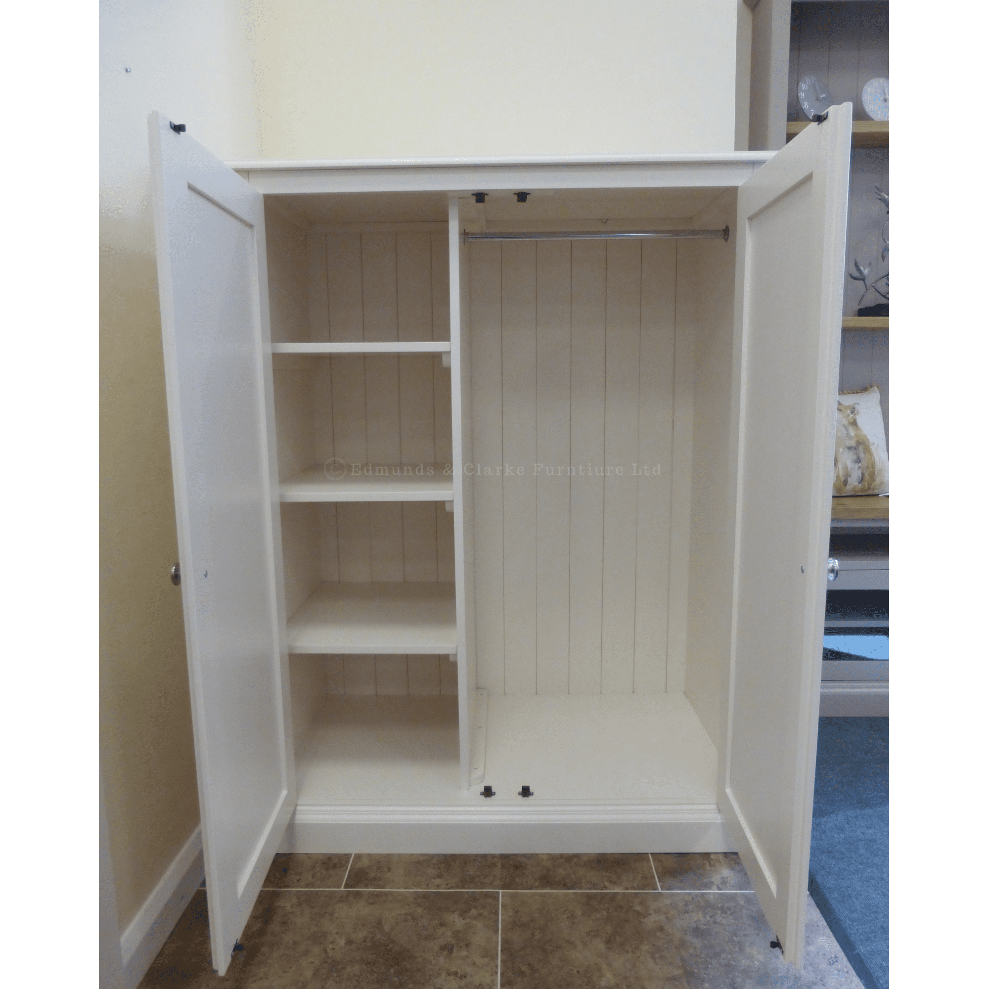 Edmunds Low Eave robe showing shelves and doors open. Edmunds & Clarke Furniture