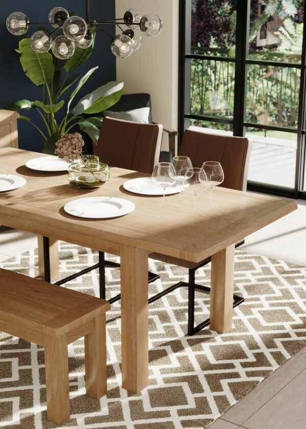 Suffolk oak dining table extending, lifestyle image. Edmunds & Clarke Furniture