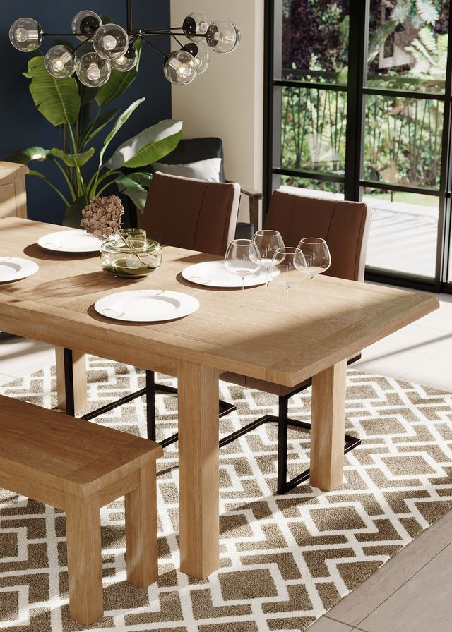Suffolk oak dining table extending, lifestyle image. Edmunds & Clarke Furniture