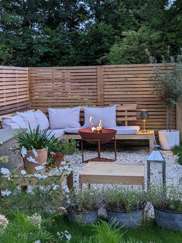 OCFR57 Outdoor cast Iron firebowl on stand Rust garden image. Edmunds & Clarke Furniture
