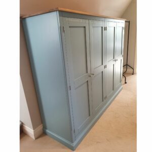 Edmunds Quad Low Eave Robe side view orwell mist and oak top. Edmunds & Clarke Furniture