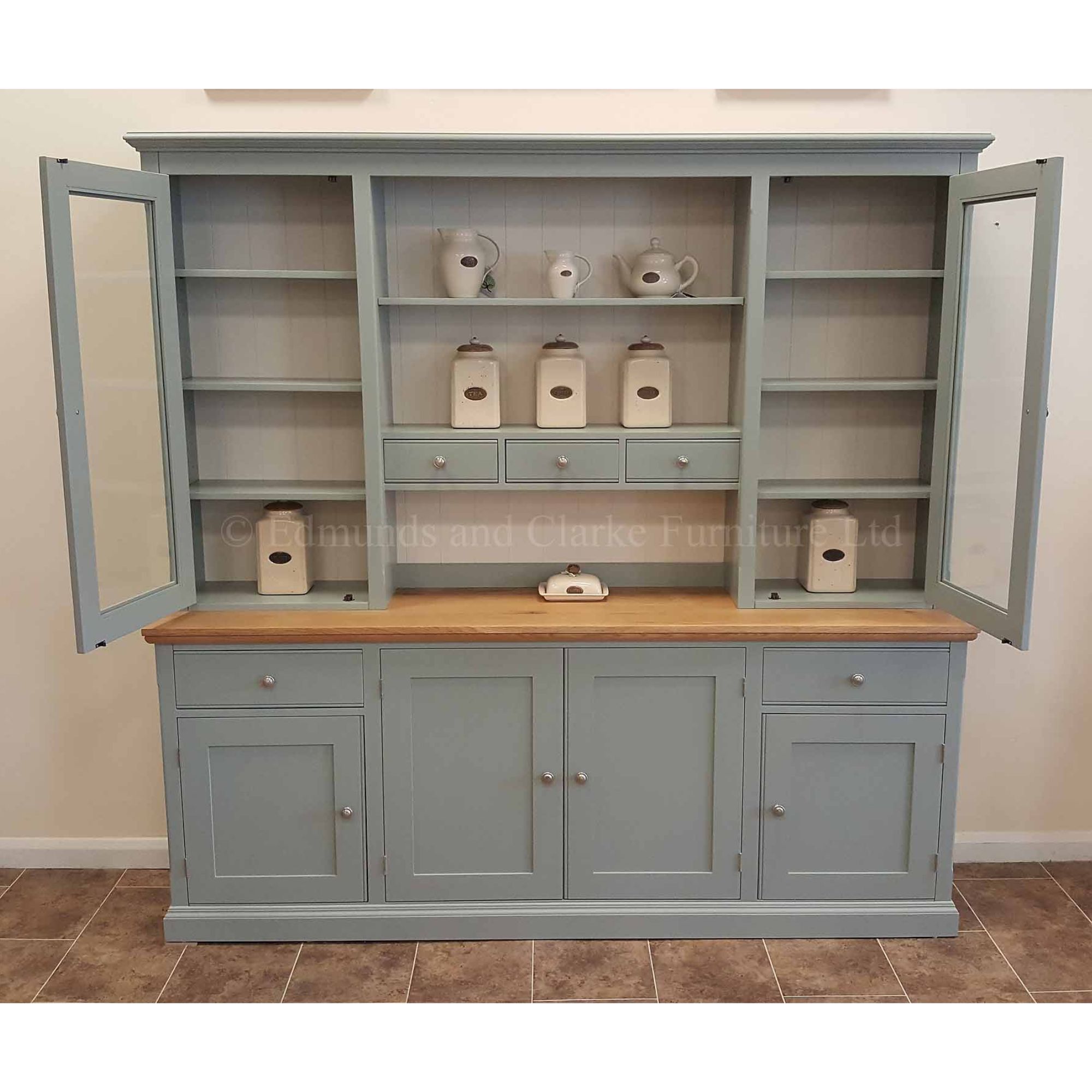 Edmunds storage dresser with spice drawers, many cupboards and two drawers. doors open. Colour Orwell Mist. Edmunds & Clarke Furniture