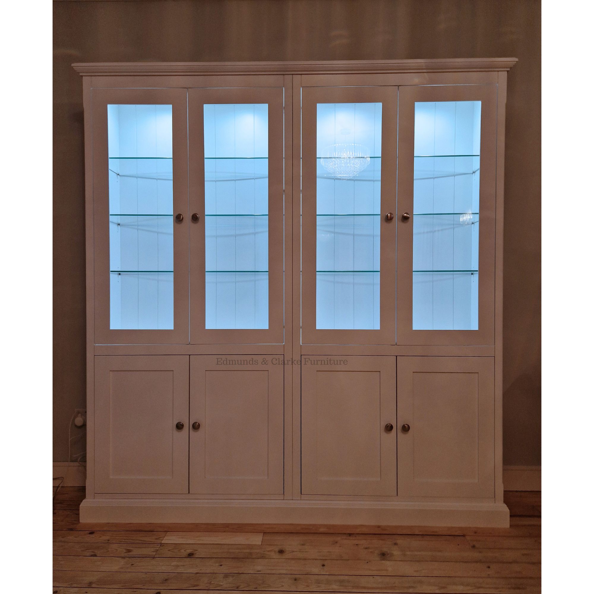 Edmunds DOUBLE Half Glazed Bookcase With lights on inside glazed part. Edmunds Clarke Furniture