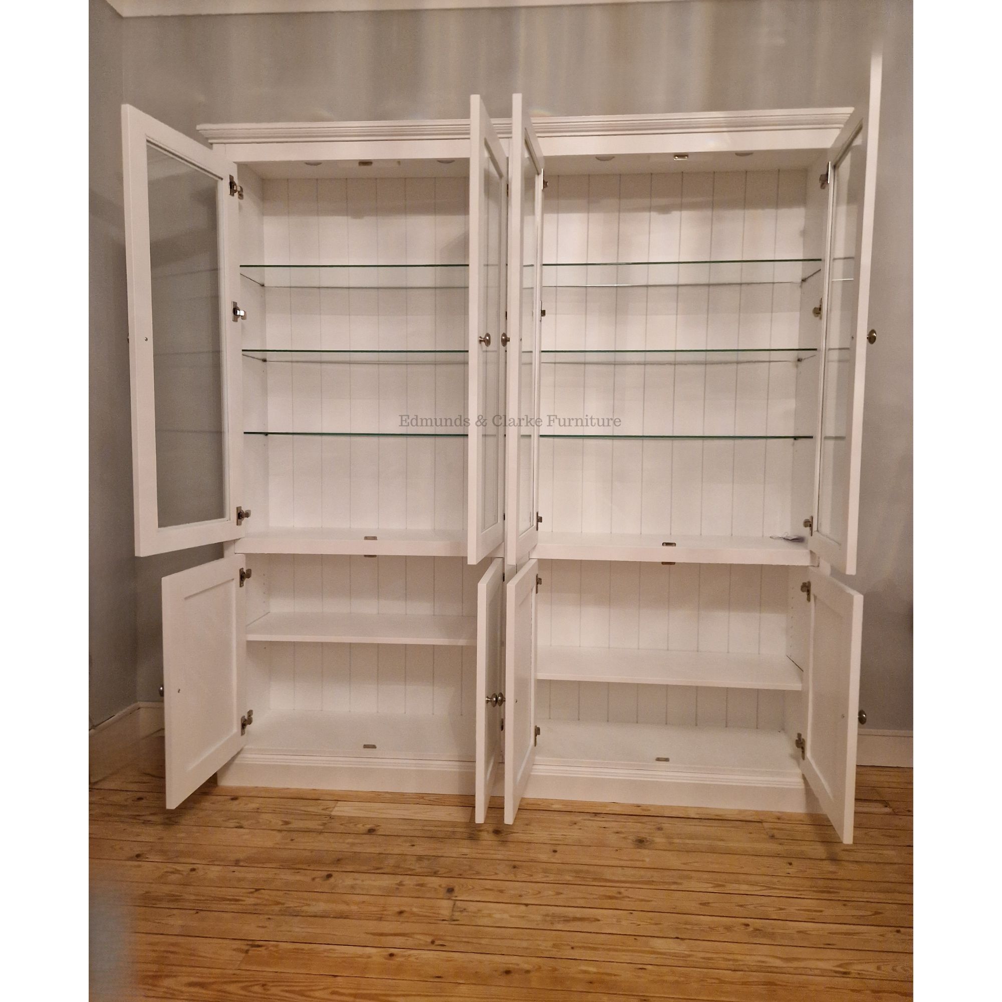 Edmunds Double Glazed Bookcase with lights glass shelves. image showing doors open. Edmunds Clarke Furniture