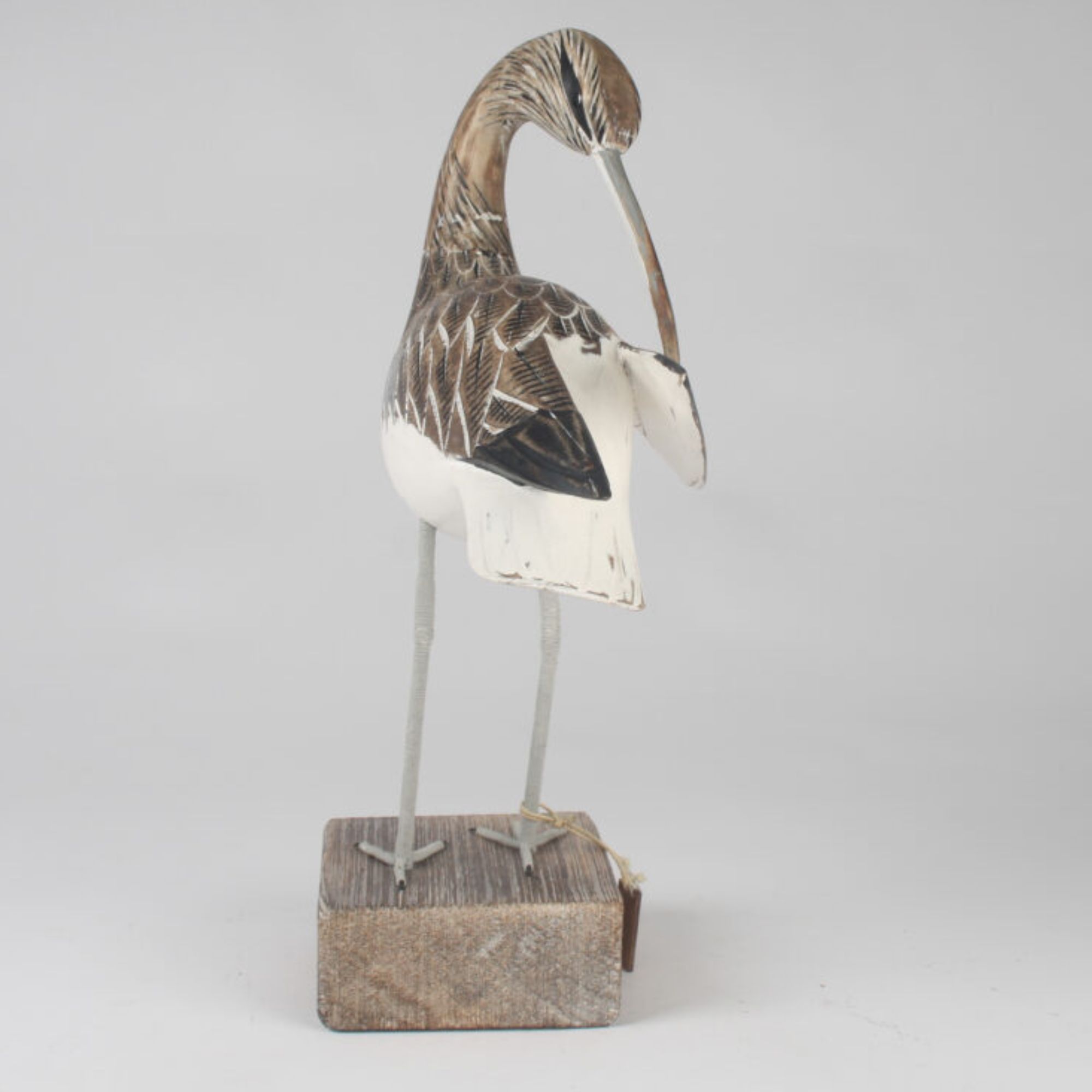 Curlew preening carving front view. Edmunds Clarke Furniture