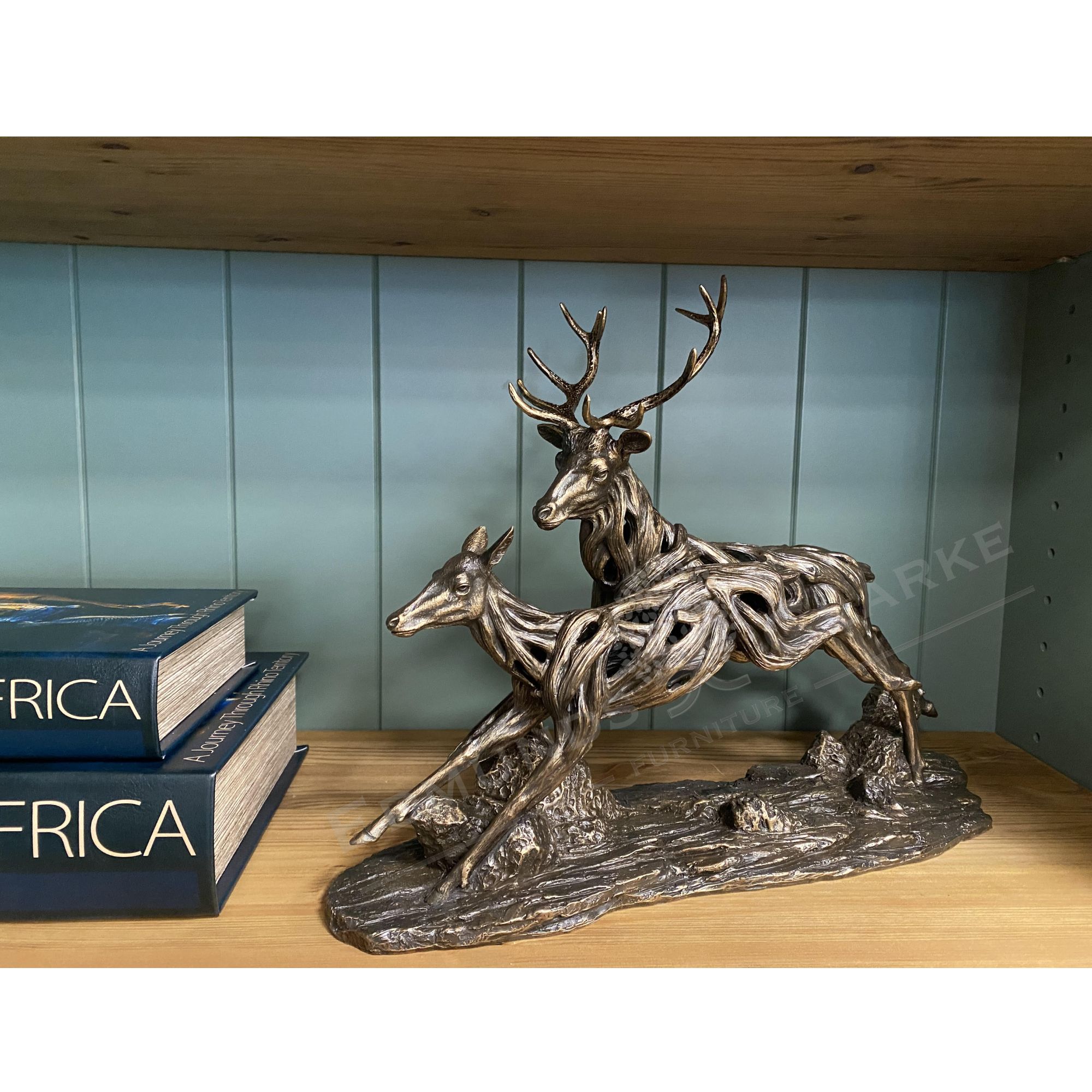 Driftwood running deer bronze sculpture room shot. Edmunds Clarke Furniture