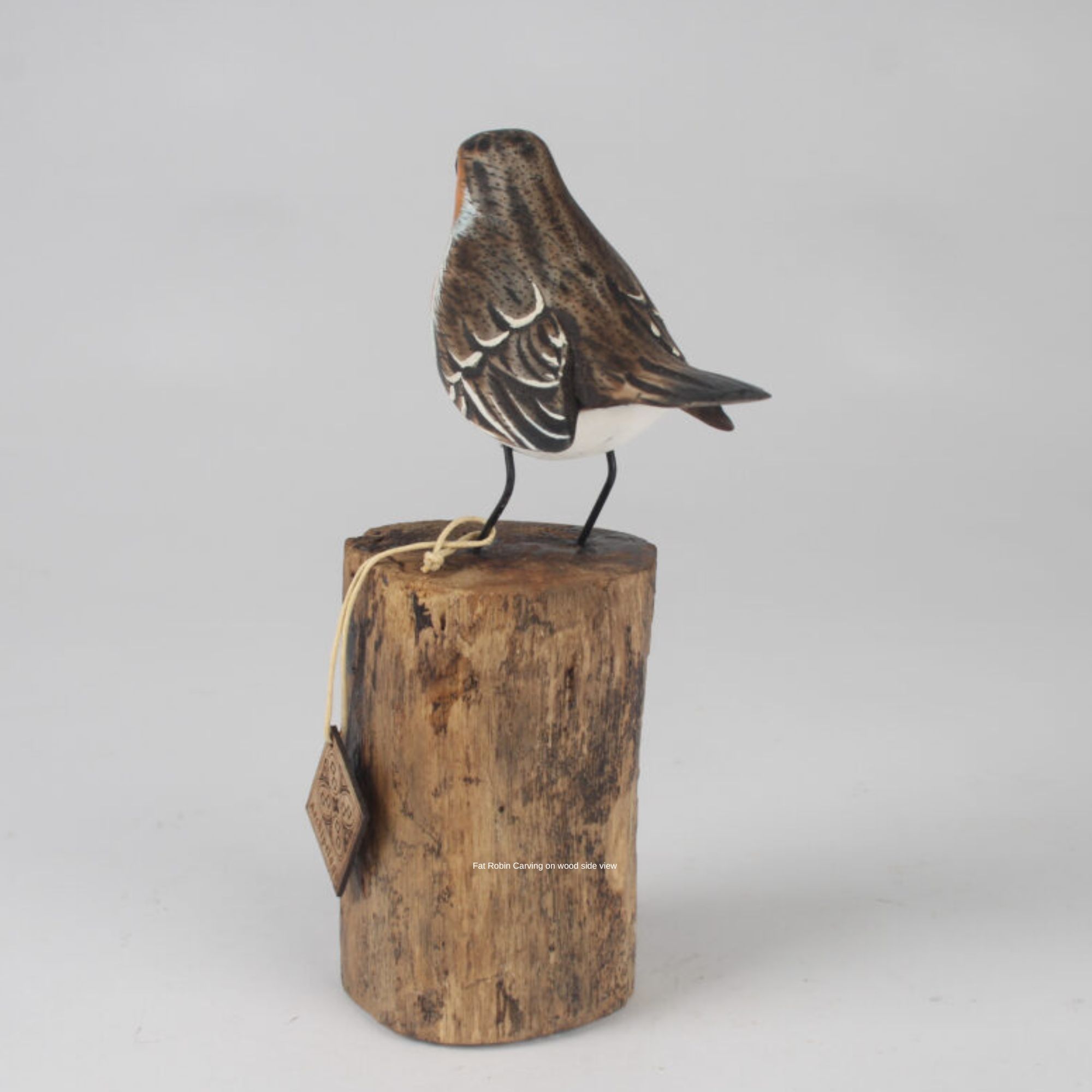 Fat Robin Carving on wood back view. Edmunds Clarke Furniture
