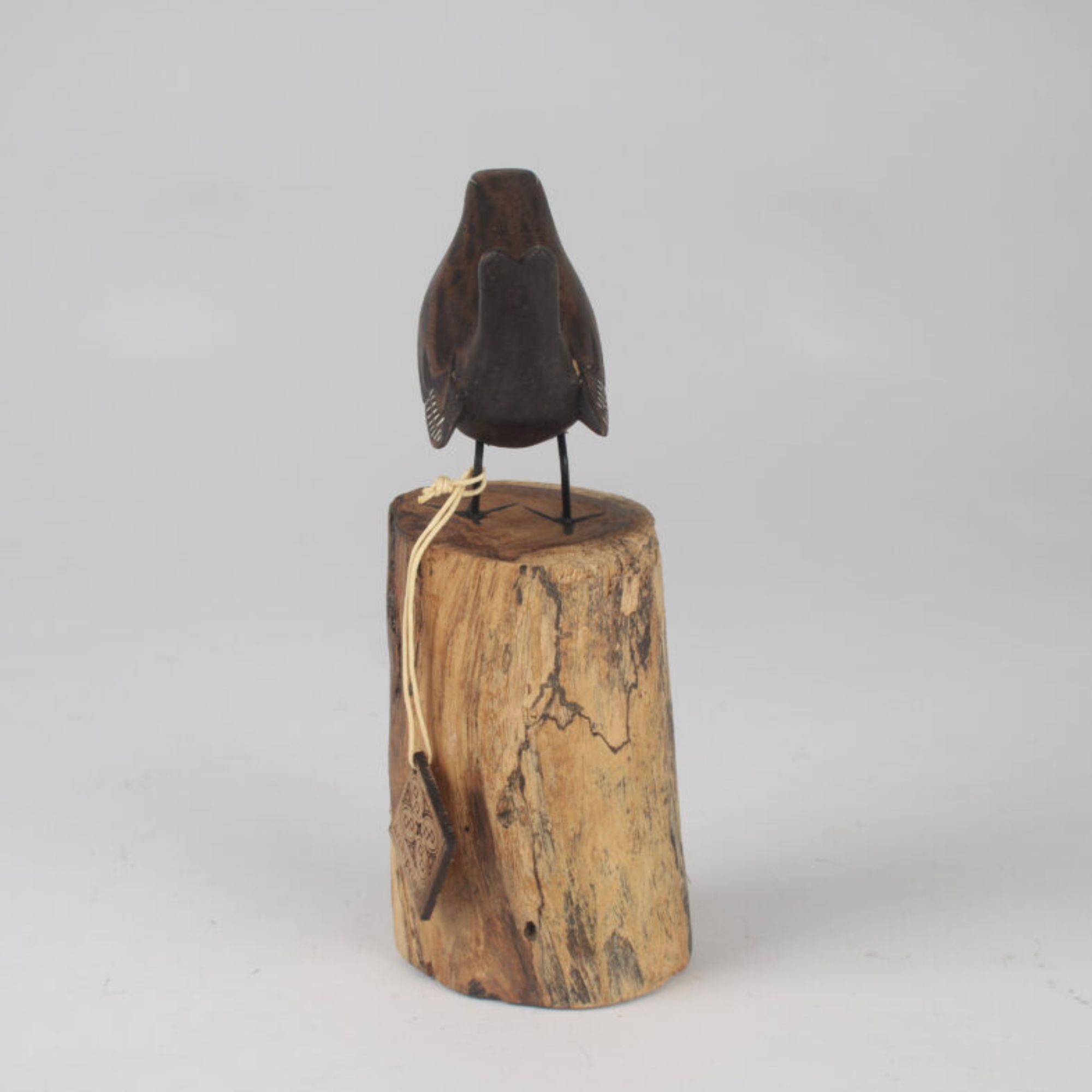 Wren carving on wooden stump back view. Edmunds Clarke Furniture