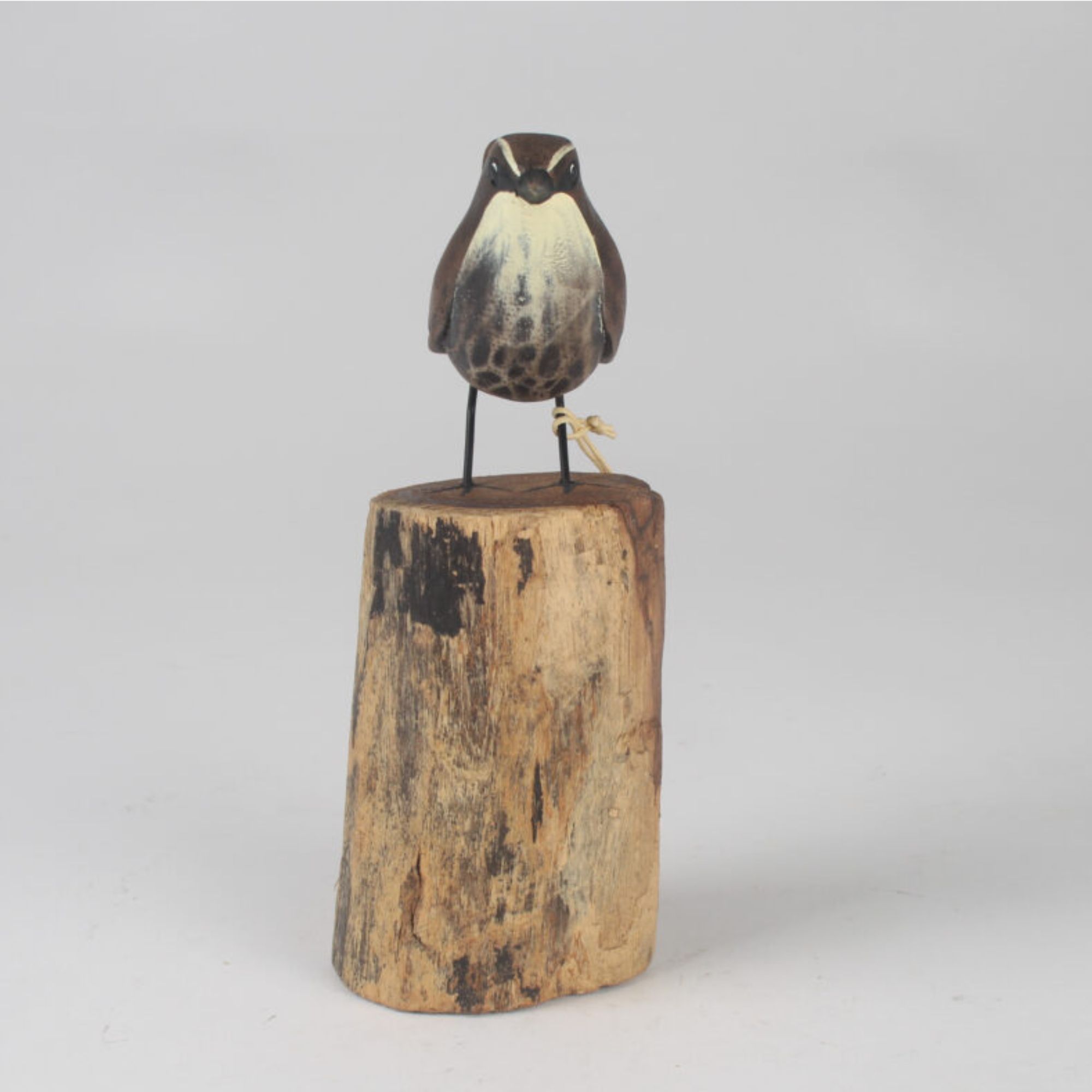 Wren Carving on stum front view. Edmunds Clarke Furniture