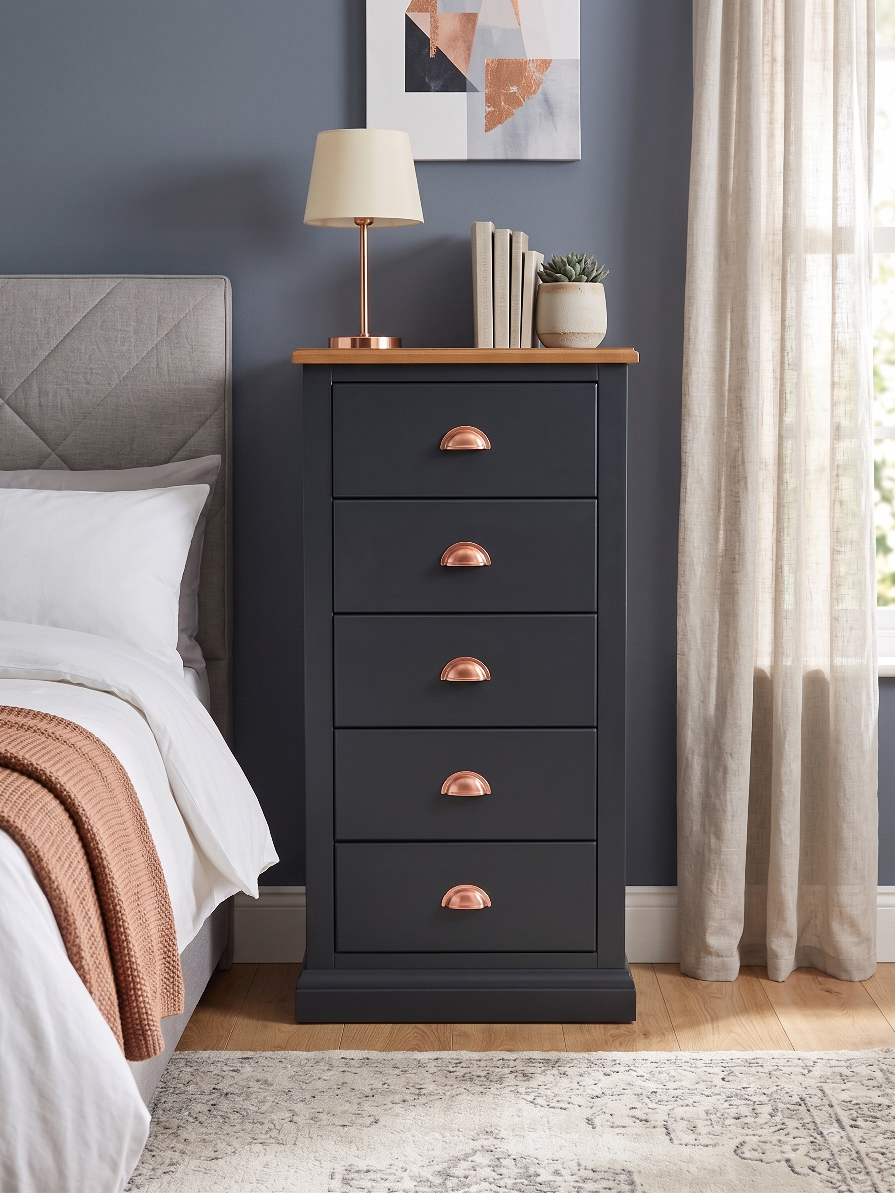 A beautiful dark painted 5drawer wellington chest with copper cup handles
